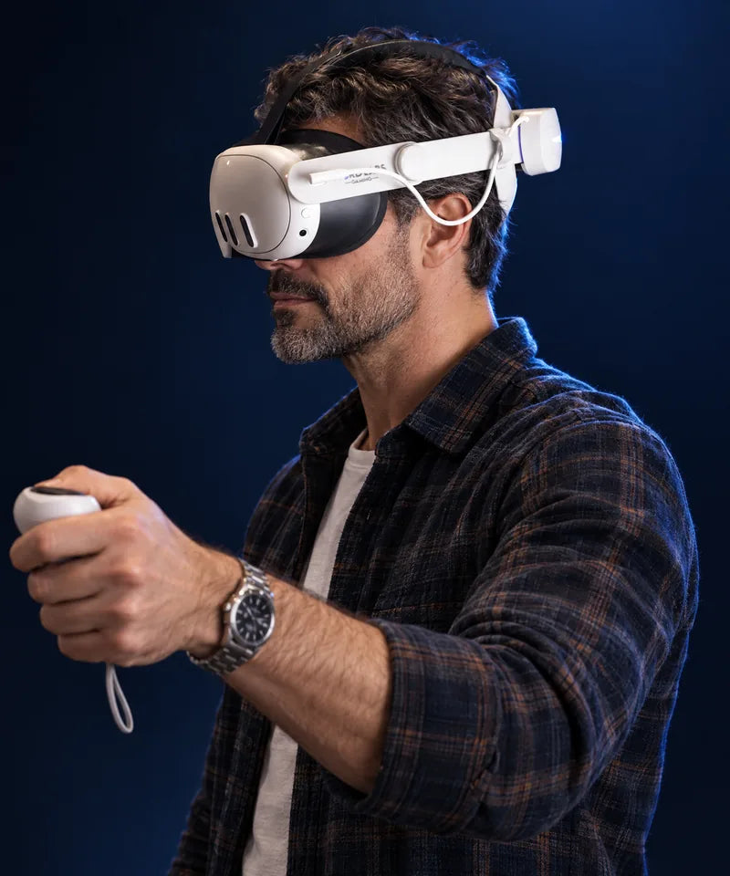 A man in his 40s playing VR on a Meta Quest 3 wearing the NordLabs Comfort Strap with Battery Pack