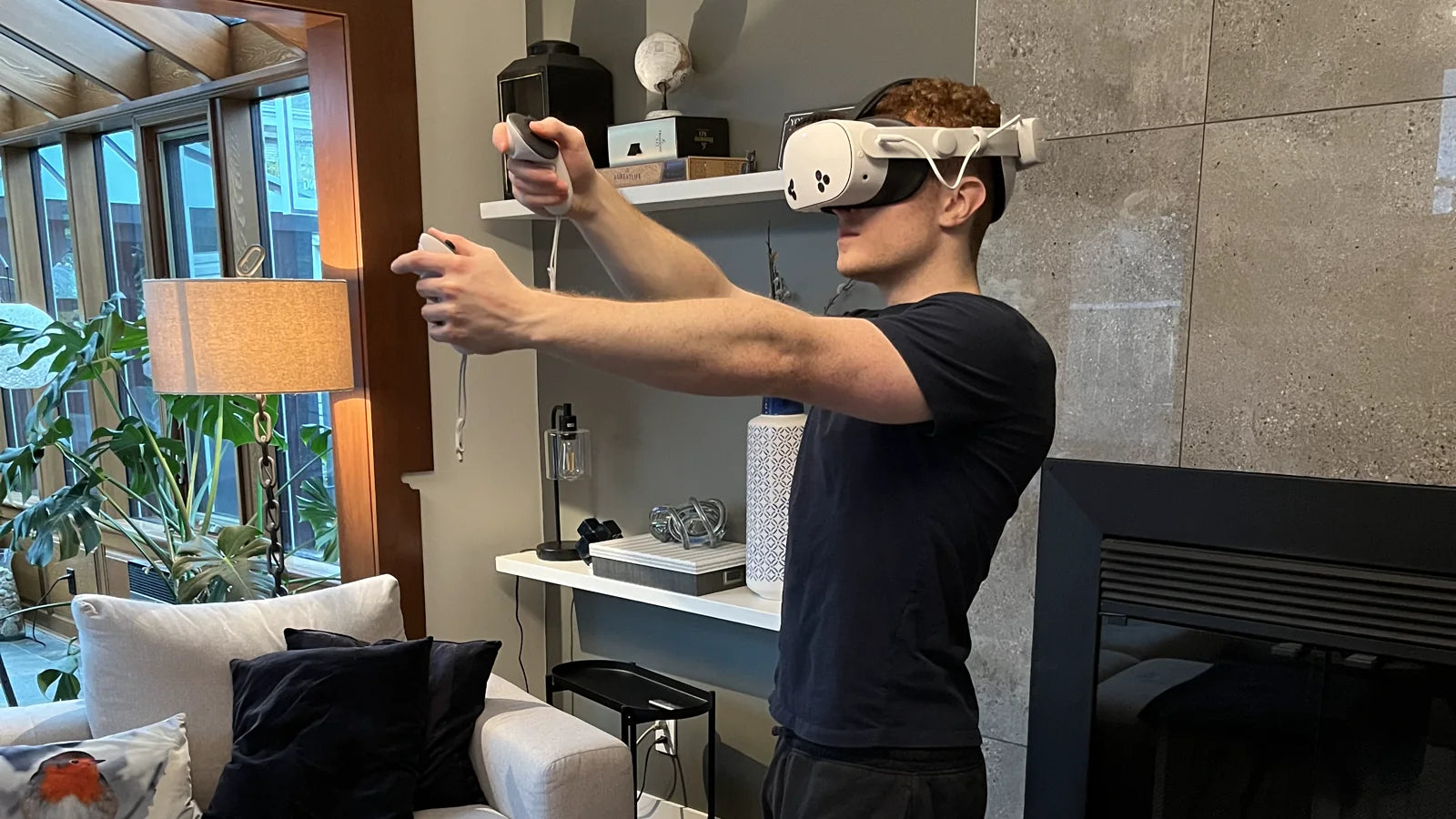 Person doing a standing VR fitness session in a living room